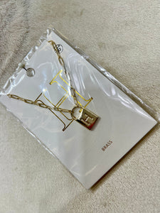 Farah Gold Tone Initial Lock Necklace