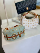 Load image into Gallery viewer, "D" Inspired "LOVE" crescent shaped Gold Studded Vegan Leather  Bag
