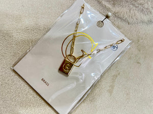 Farah Gold Tone Initial Lock Necklace