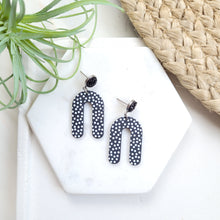 Load image into Gallery viewer, Aubrey Post Back Earrings Acrylic &quot;U&quot; Charms With Textured White Polka Dots